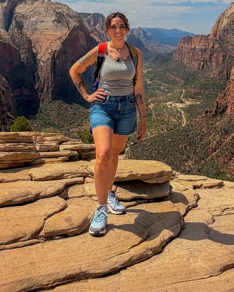 Bobby McKinley, owner of Verde Valley Photo Preservation, standing on red rock above a canyon in northern Arizona.